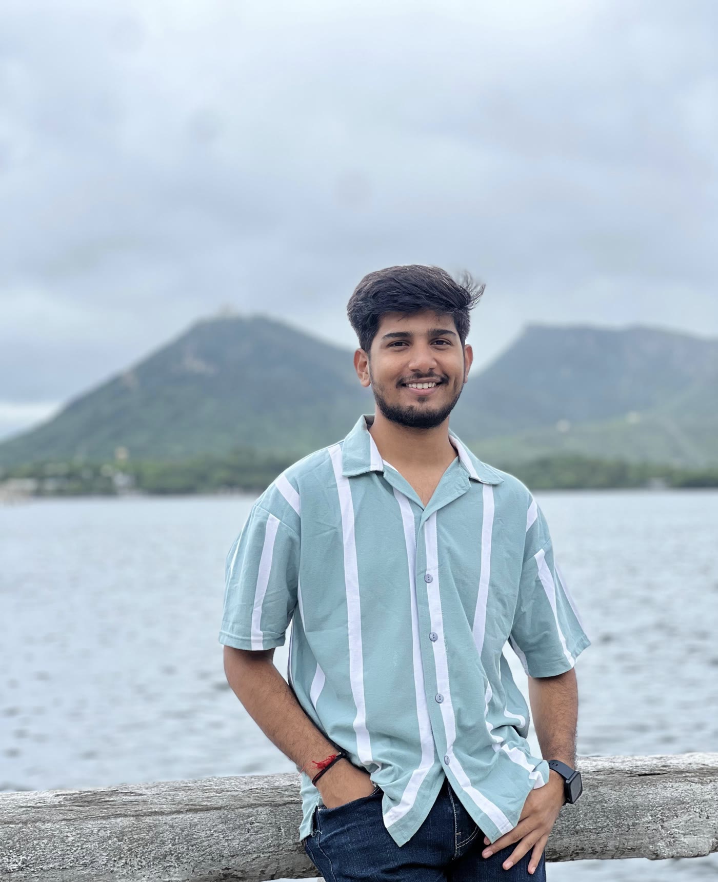 Sachin Patidar, tech UGC creator, smiling outdoors in a striped shirt